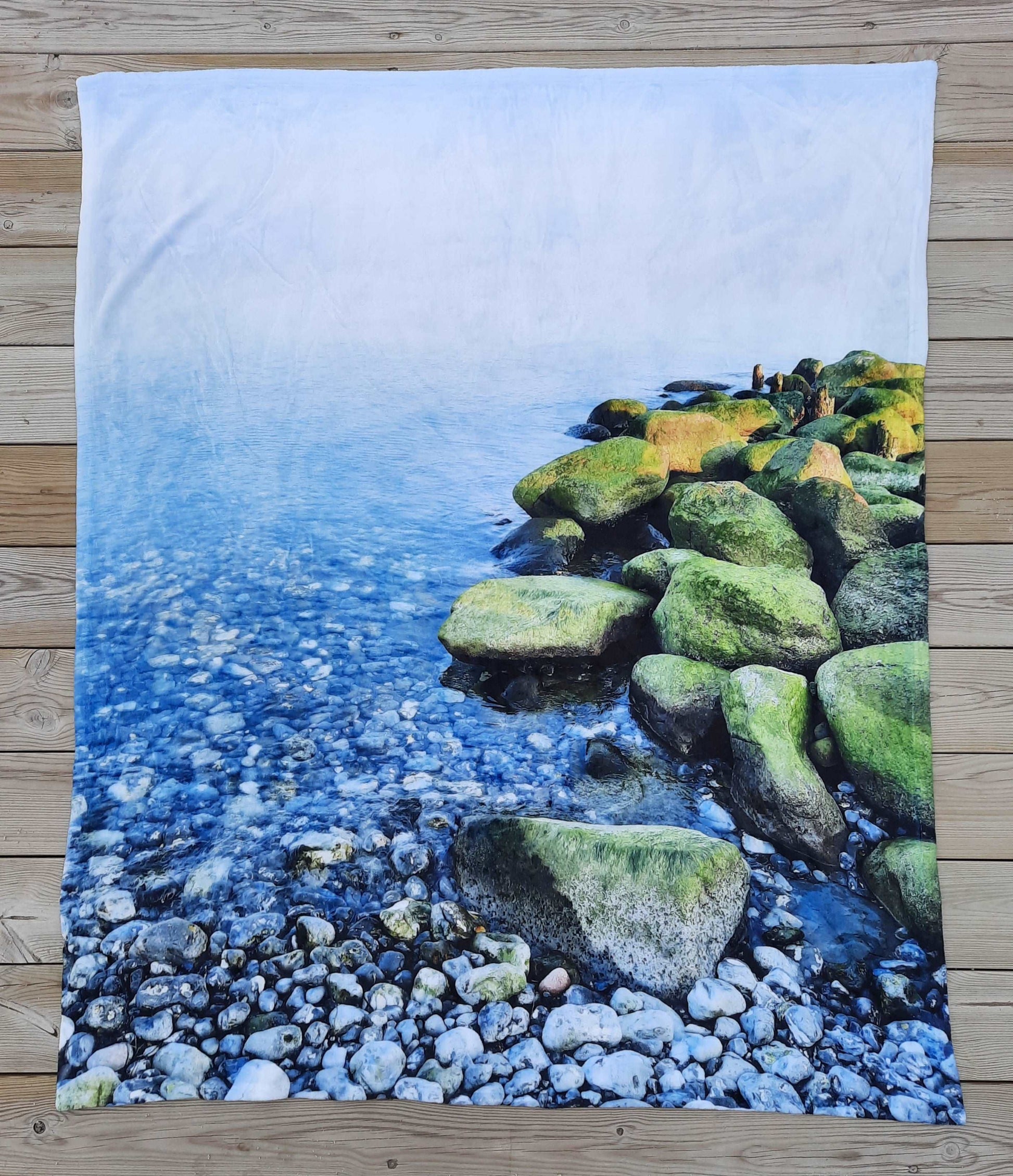 Calming stones sea blanket on pier